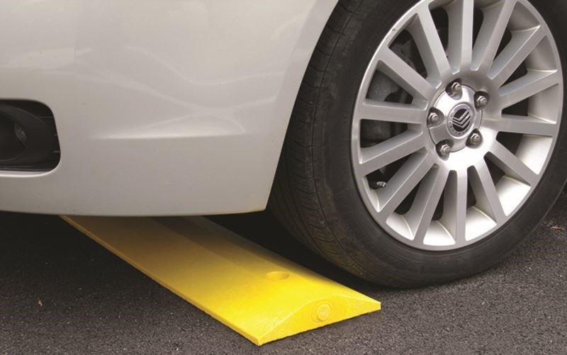 Image of a recycled plastic speed bump designed for parking lot and garage safety.