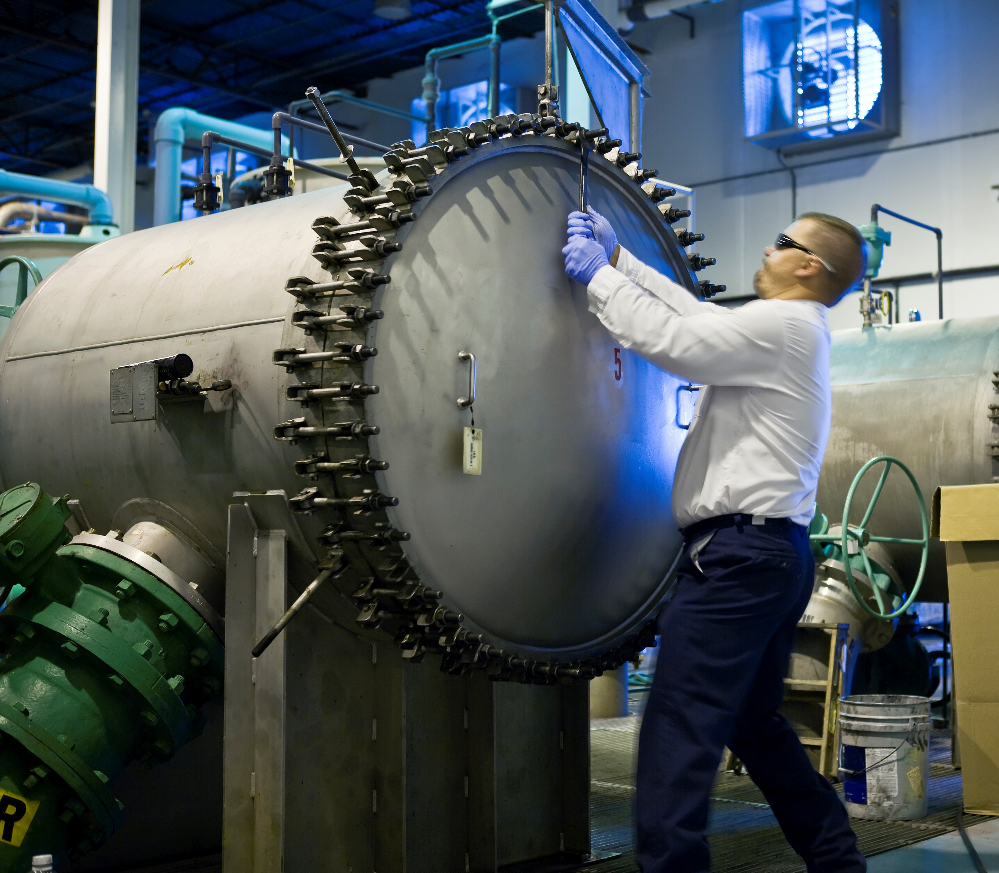 Image of a marine industry professional standing on marine safety mats.